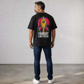 vvicked black oversized cotton t-shirt with a colorful rocket graphic on the back worn by a man in jeans