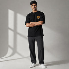 Model wearing a black vvicked oversized cotton t-shirt with a Galactic Summer Fest graphic on the chest