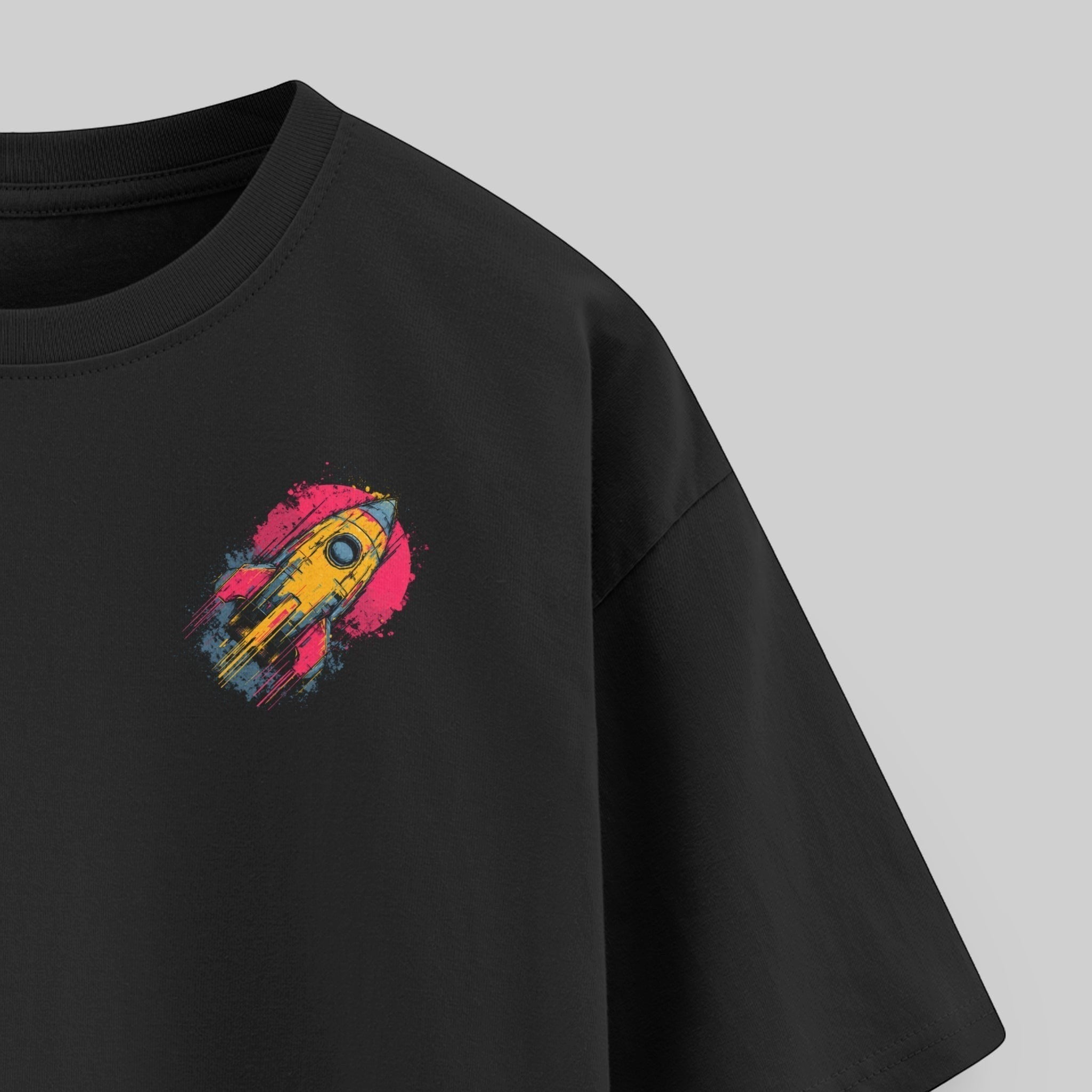 vvicked black oversized cotton t-shirt with a vibrant yellow and pink rocket graphic on the chest